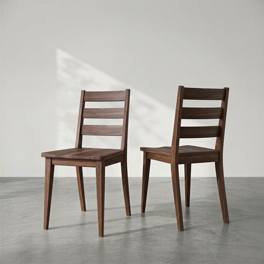 Two wooden chairs on a gray floor with a white background