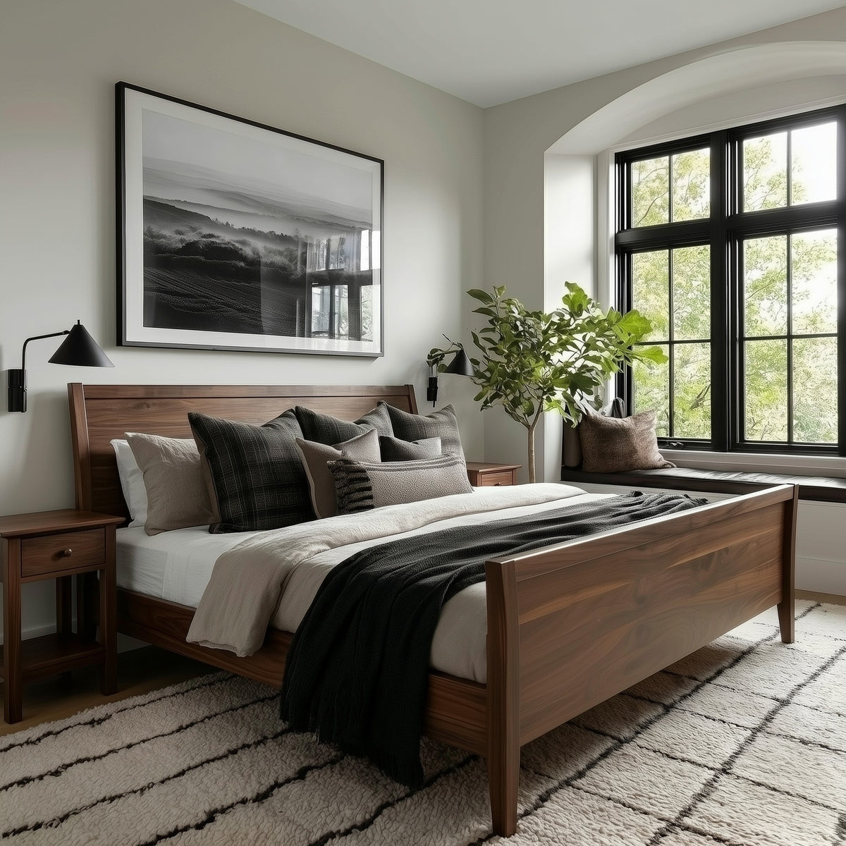 Bedroom with wooden bed, pillows, and a large window.