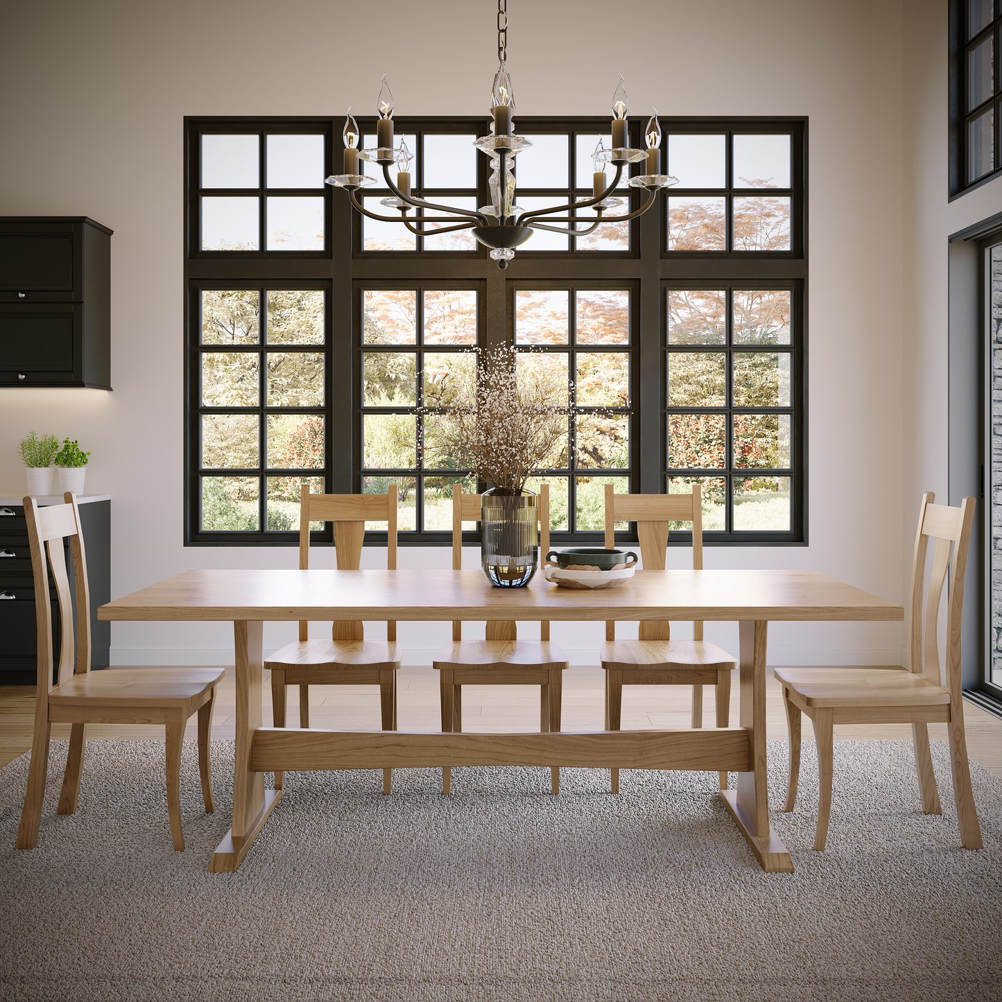 Dining room with wooden table and chairs under a chandelier.