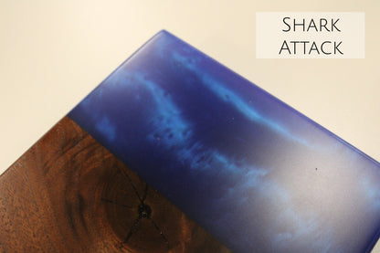 A close up of a walnut and blue epoxy sample