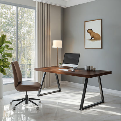 A modern desk with a dark wood top and metal legs in a home office setting, accompanied by a swivel chair, lamp, and decorative painting on the wall.