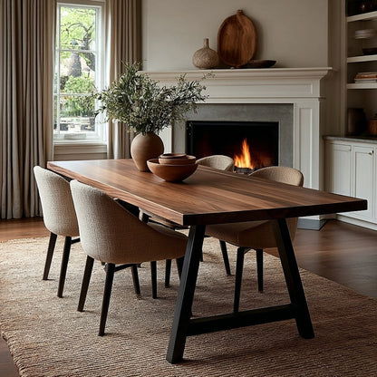 Dining room with wooden table and chairs in front of a fireplace