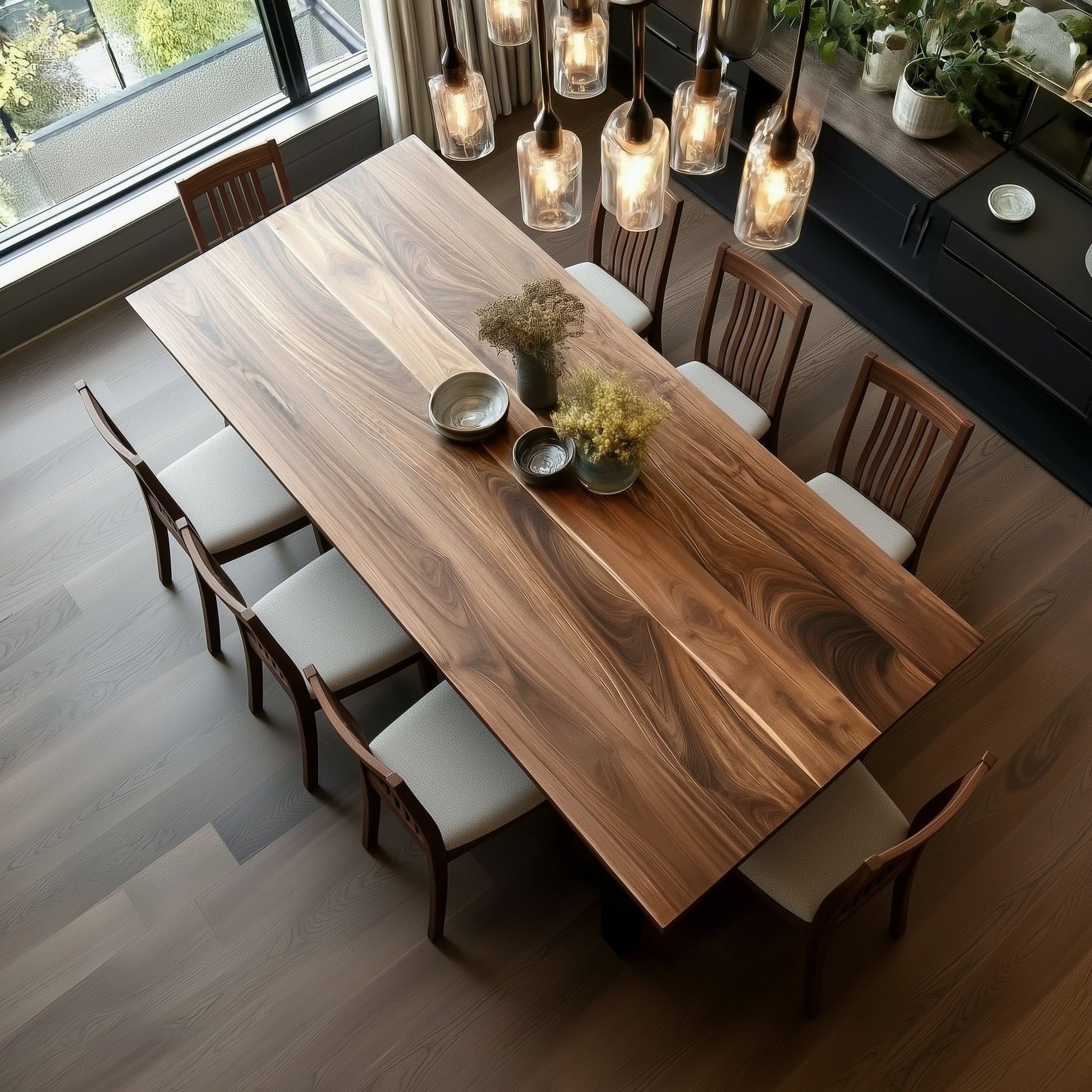 Dining room with a wooden table and chairs near a window.