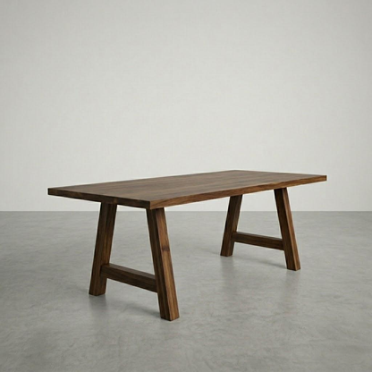 Wooden table with a minimalist design on a gray floor and white wall background