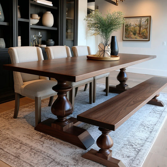 Dining room with wooden table, chairs, and bench on a rug.