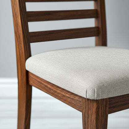 Wooden chair with a beige cushion on a light gray background