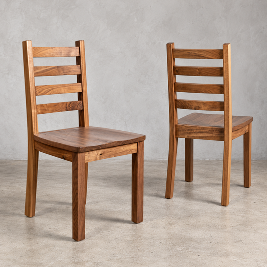 Two Walnut Coleman Chairs featuring matching solid wood seats, natural walnut grain, straight wooden legs, and classic ladder-style backs.