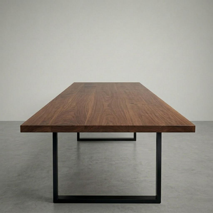 Wooden table with black metal legs on a gray background