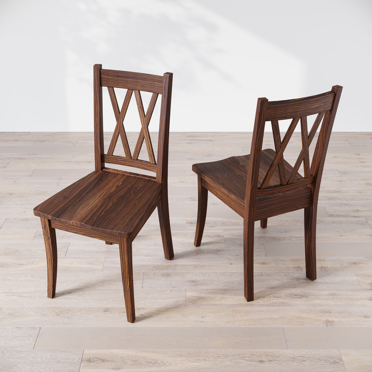 Top down view of two walnut wood dining chairs with a 'Double X Back' design, placed against a neutral background.