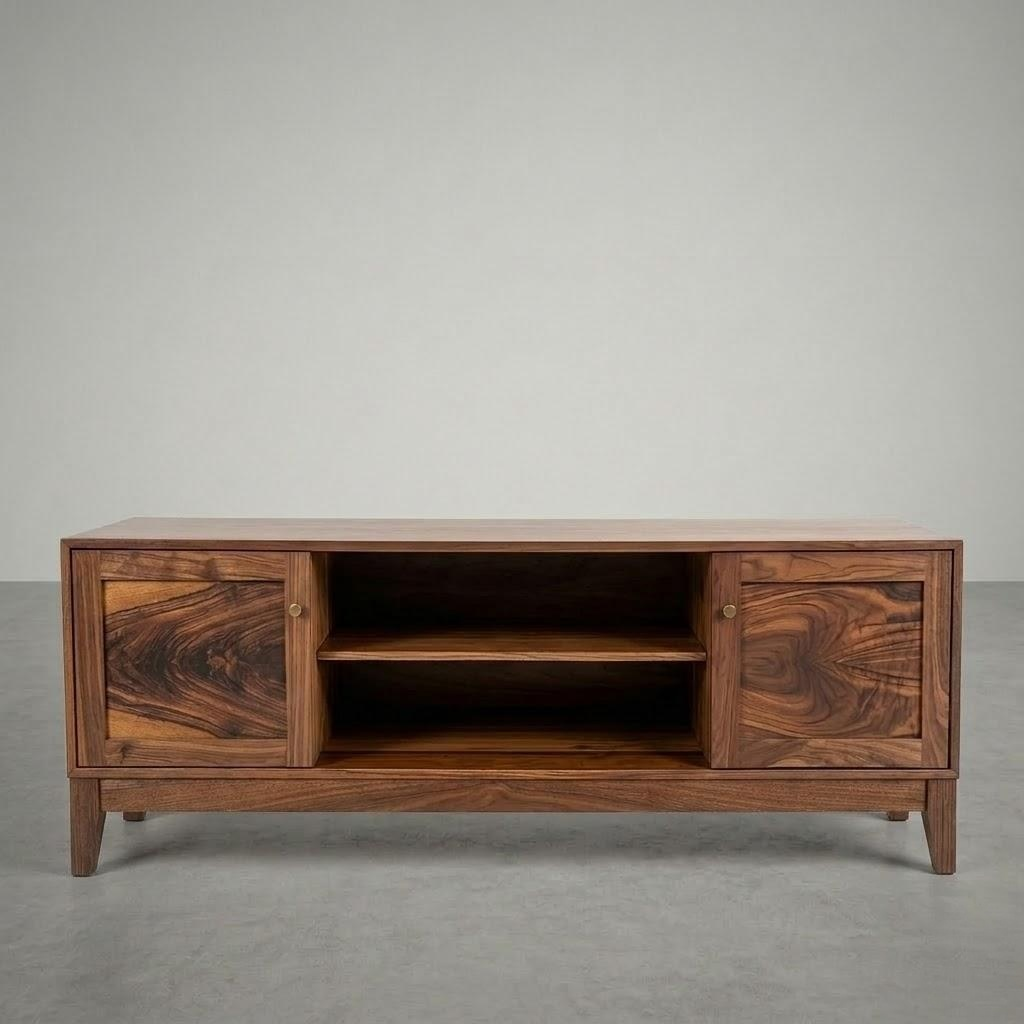 Wooden entertainment console with two doors and a shelf in the middle placed in a large empty space