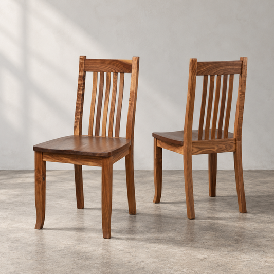 Two Walnut Ensworth Dining Chairs with matching solid walnut seats, warm brown wood grain, tapered legs, and traditional vertical slat backs.