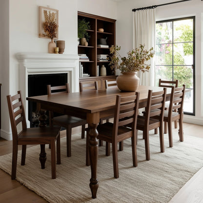 Dining room with wooden table and chairs, fireplace, and large window.