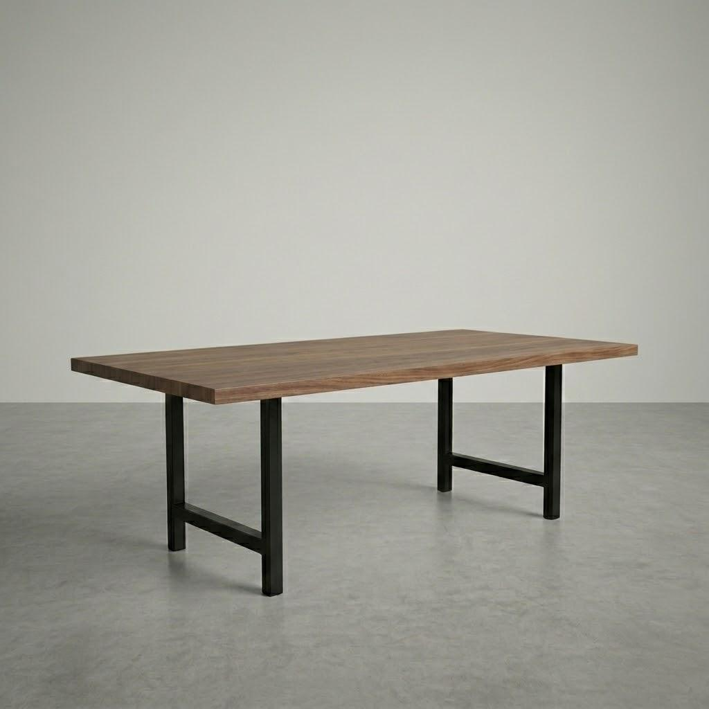 Wooden table with black metal legs on a gray floor and background