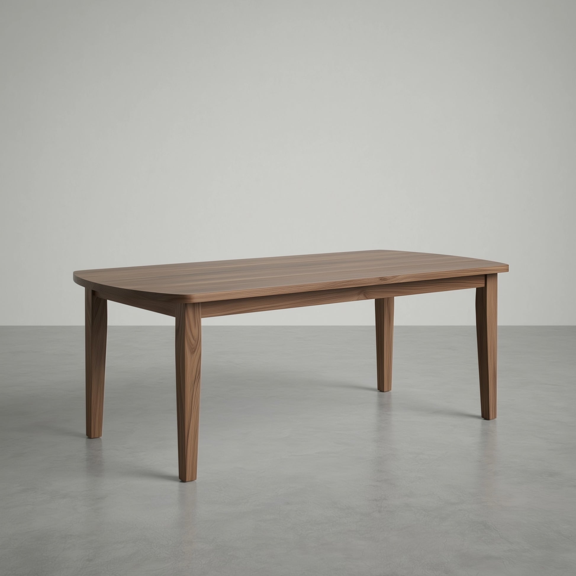 walnut dining table in a large empty space