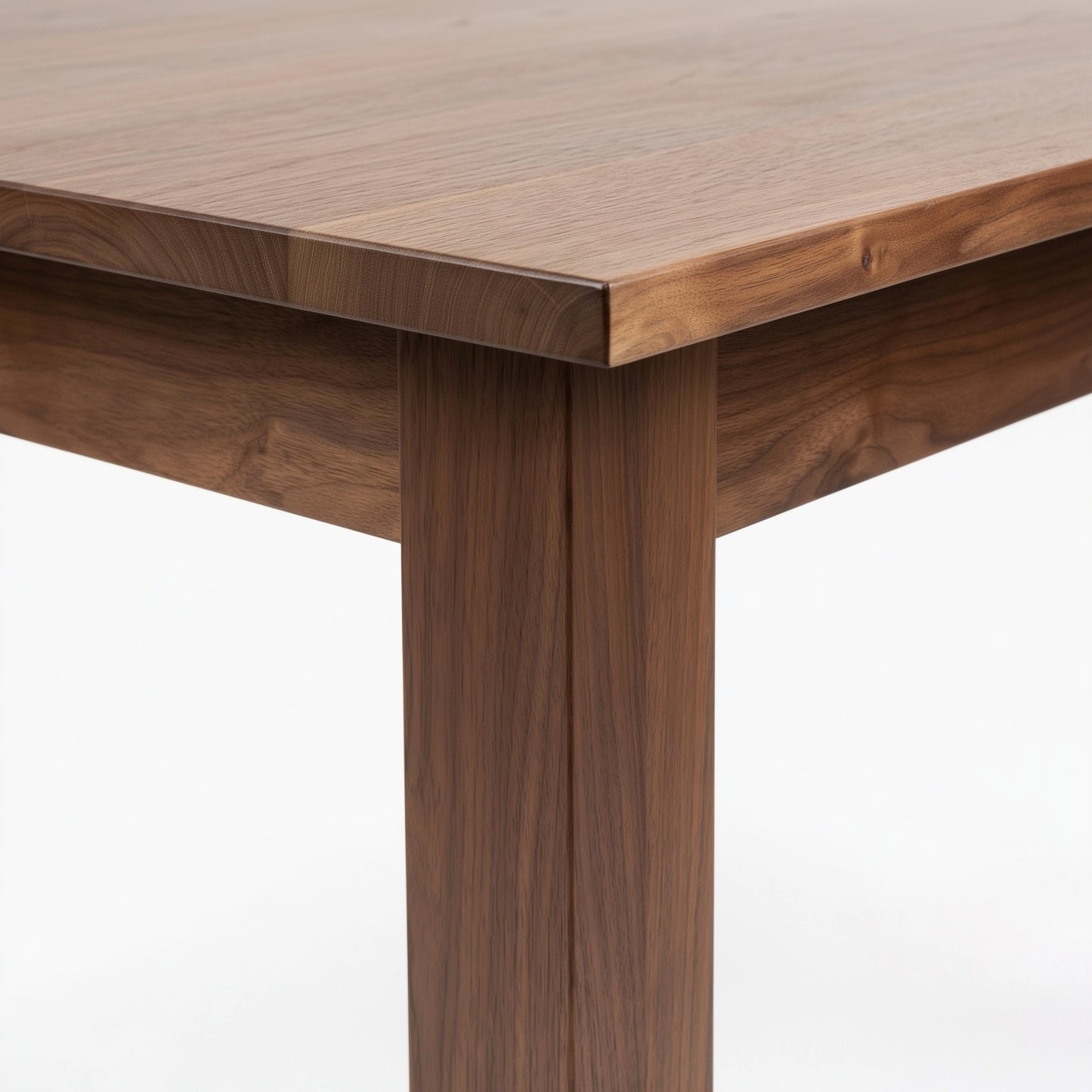 Close-up of a wooden table with a white background