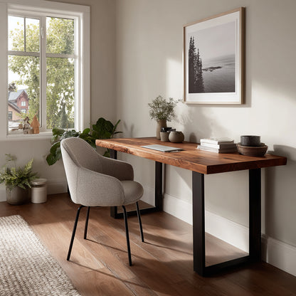 Home office with wooden desk, chair, and framed picture on wall