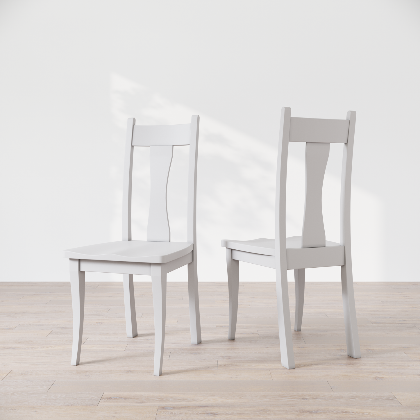 Two white wooden dining chairs with, one in front of the other, against a white background.