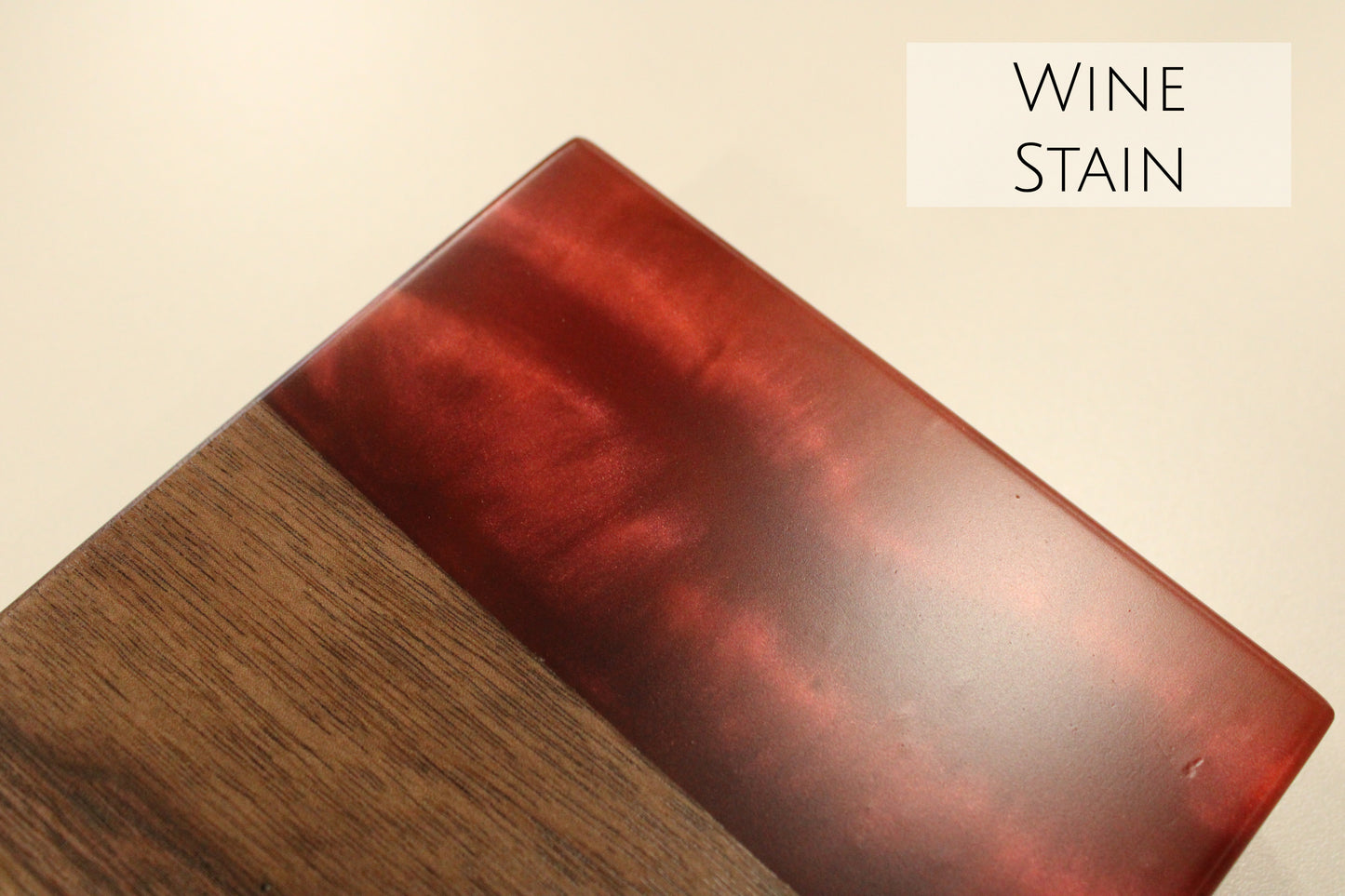 A close up of a walnut and red epoxy sample